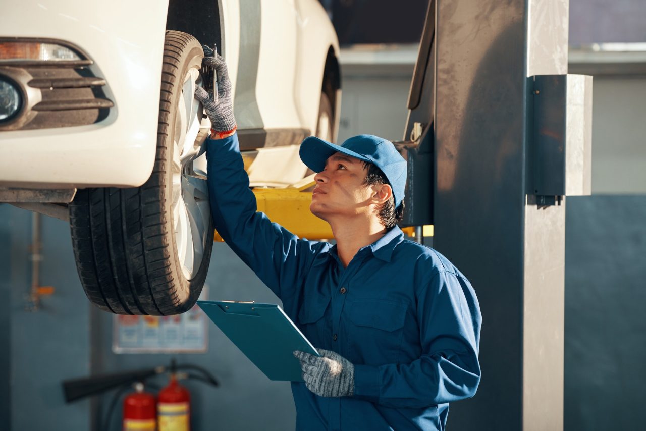 mechanic checking car